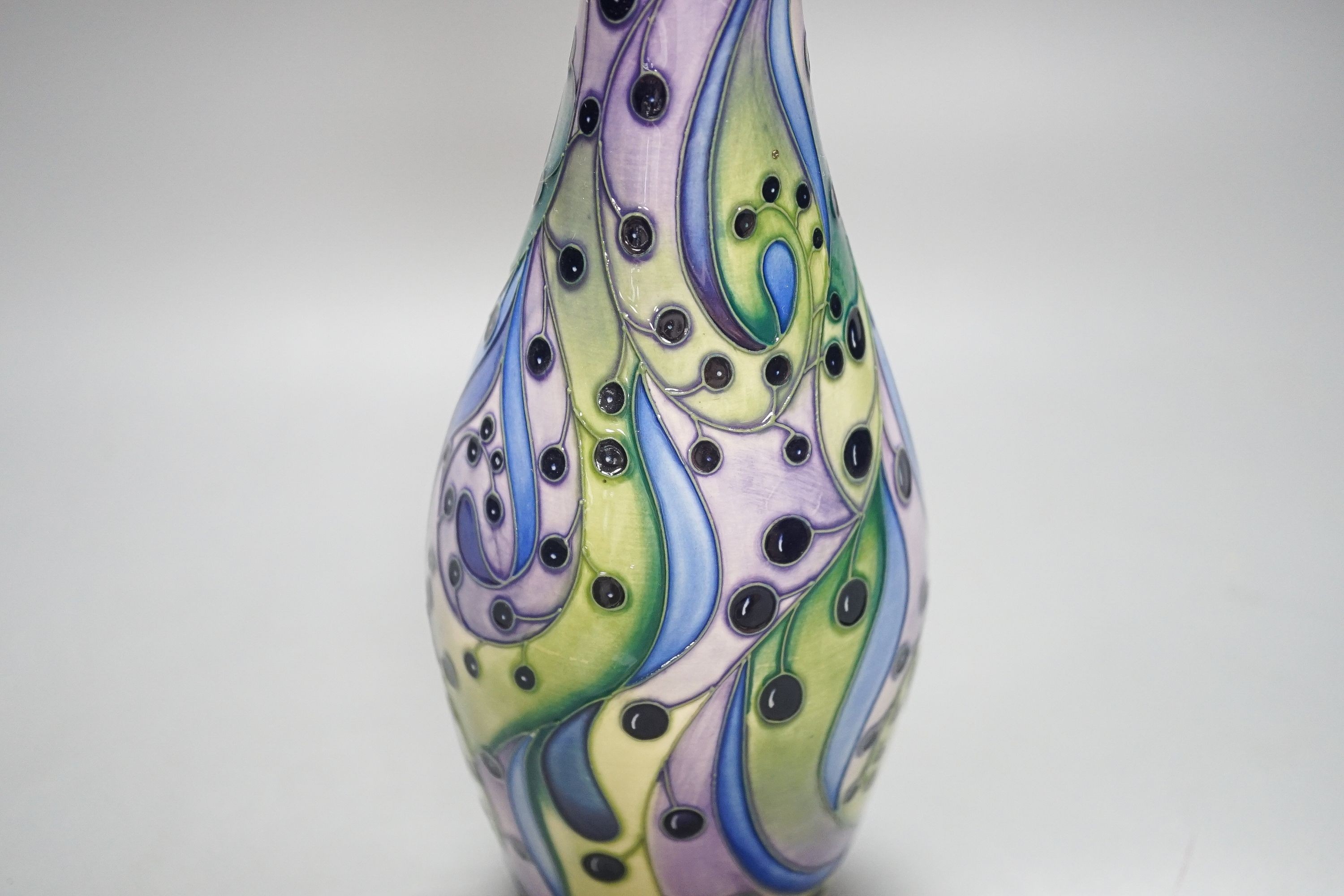 A Moorcroft bottle vase, stylised berries 31cm